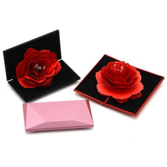 Rotating Rose Ring Box Valentine'Diamond Shaped Vibrato With Rotating Rose Ring Box Valentine's Day GifProduct Information :

 Outer frame size: 12*6.5*2.2CM, white box size: 13*7.4*2.6CM
 
 Materials: ABS plastic shell sprayed with rubber oil, inner flannel, flower eCosmikCartShopper